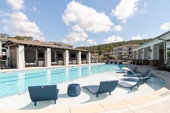 Sparkling swimming pool with in-pool tanning ledges and two designated swimming lanes